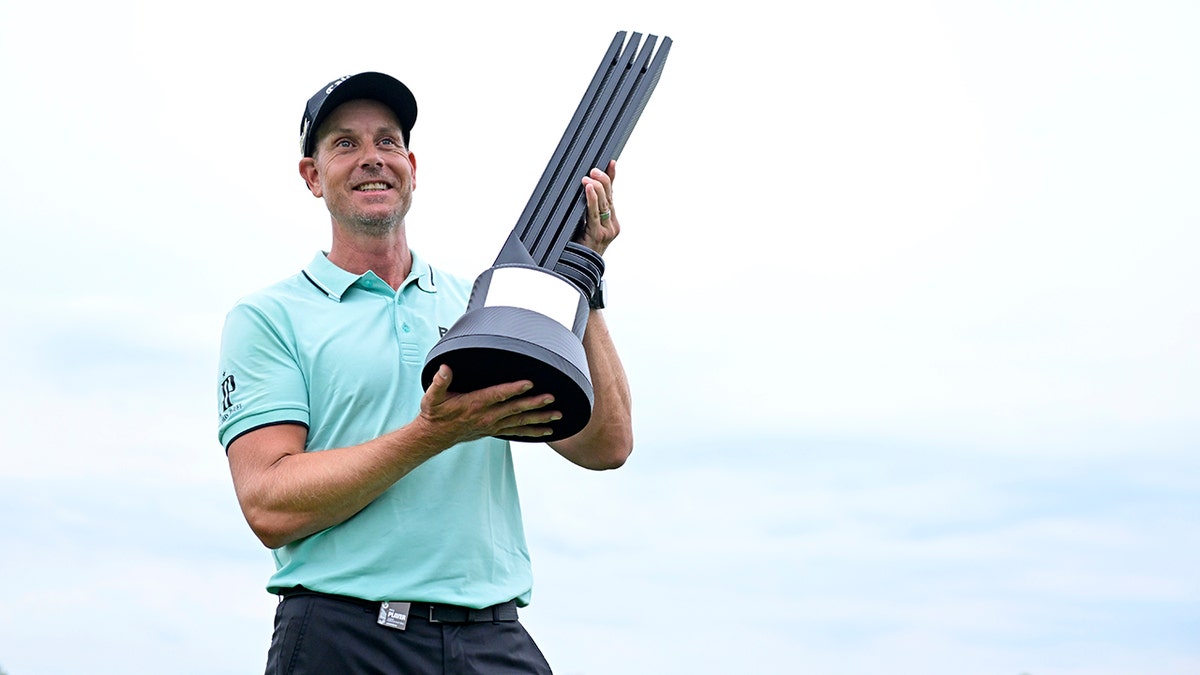 Henrik Stenson poses with trophy