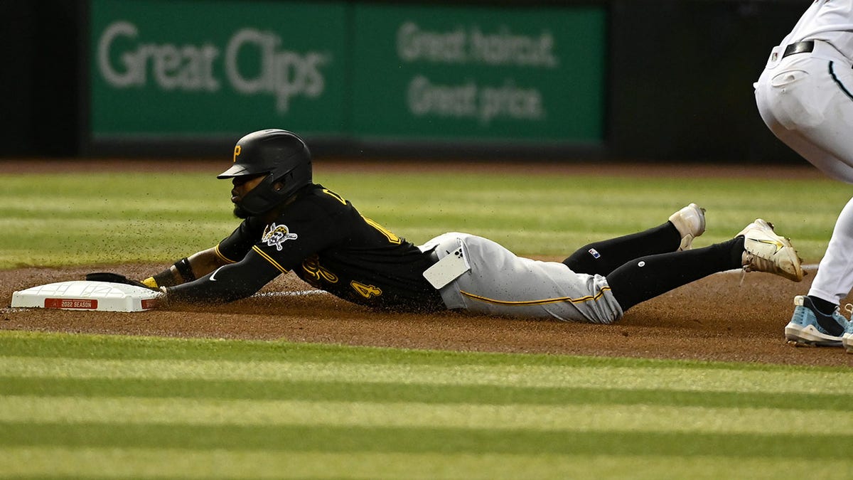 Pirates' Rodolfo Castro has his phone fall out of his pocket during a game
