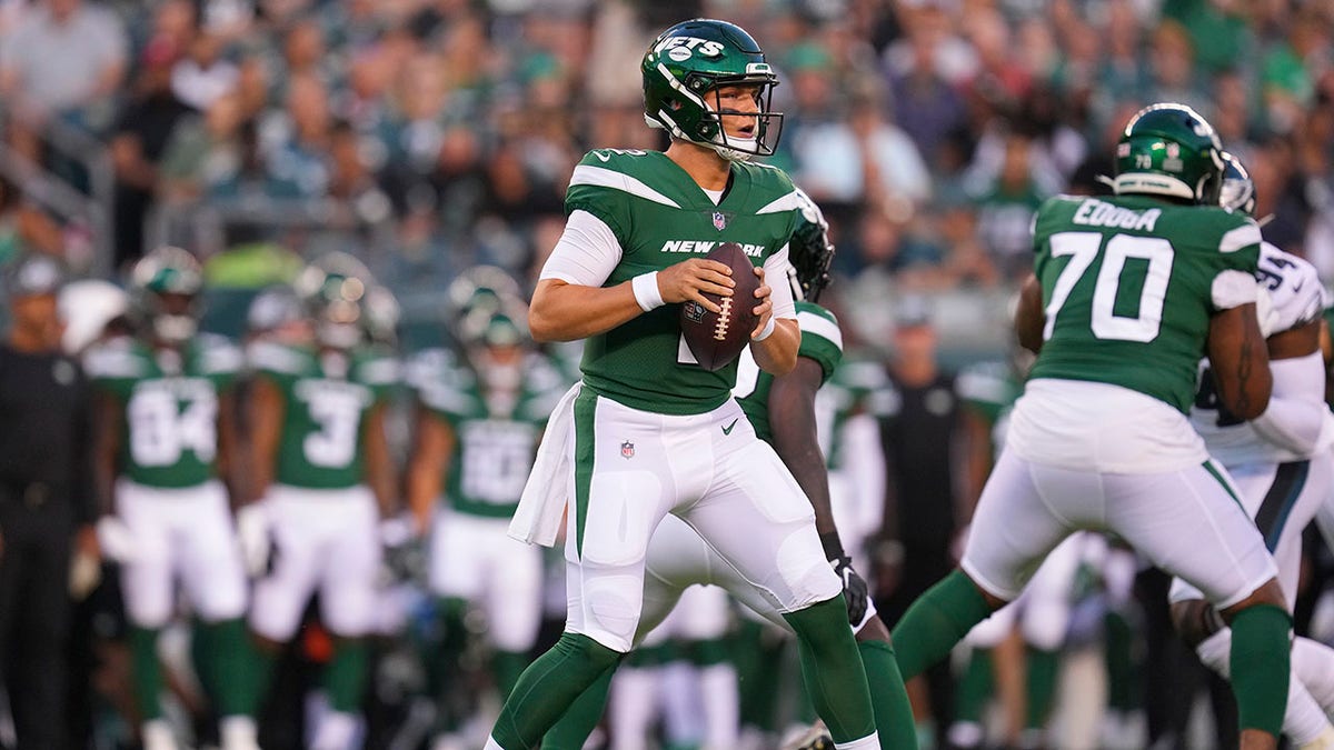 Jets quarterback Zach Wilson drops back to pass against the Eagles