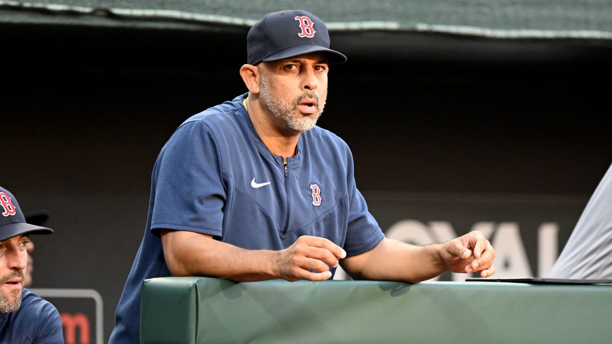 Red Sox manager Alex Cora looks on from the dugout