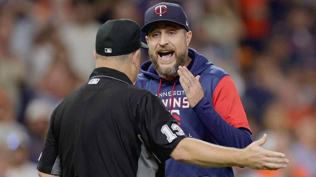 Twins manager Rocco Baldelli argues a call against the Astros