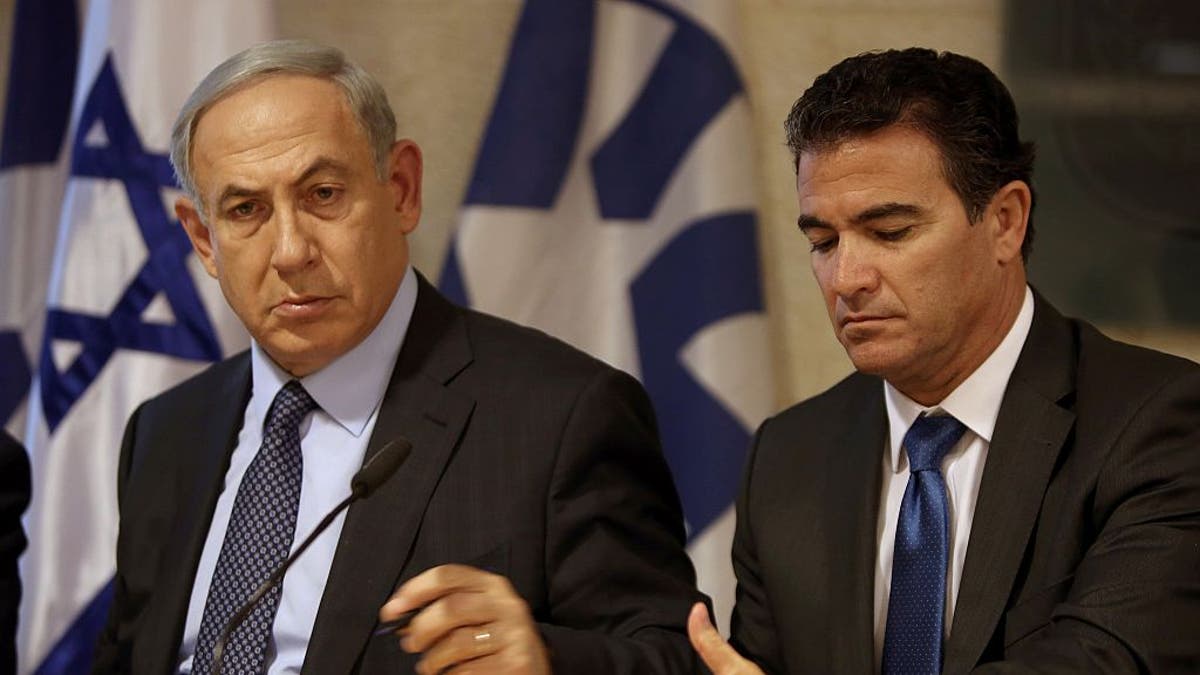 Yossi Cohen, former head of Mossad and former Prime Minister Benjamin Netanyahu sit together