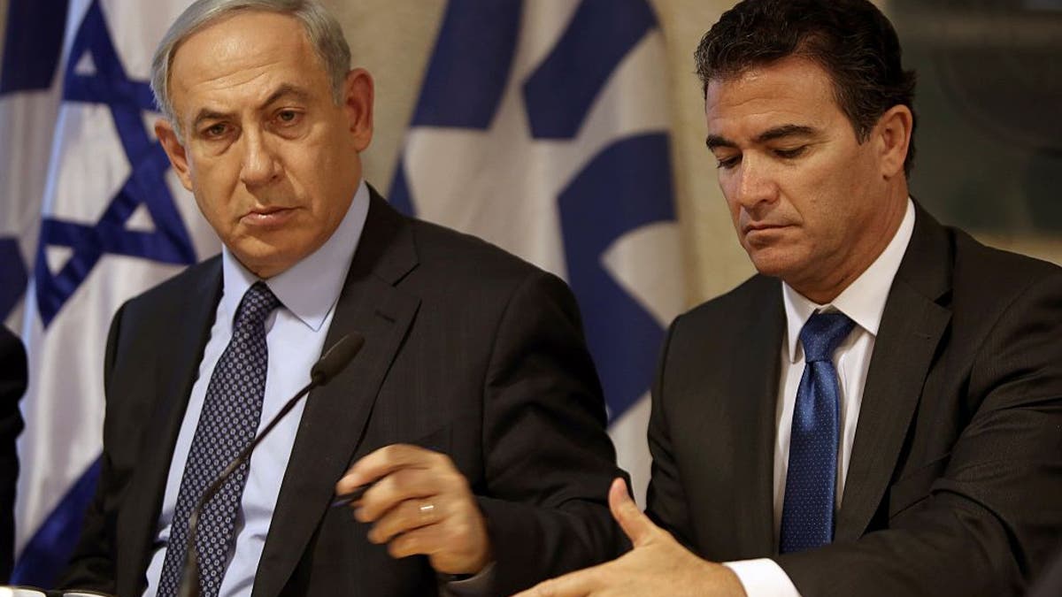 Yossi Cohen, former head of Mossad and former Prime Minister Benjamin Netanyahu sit together