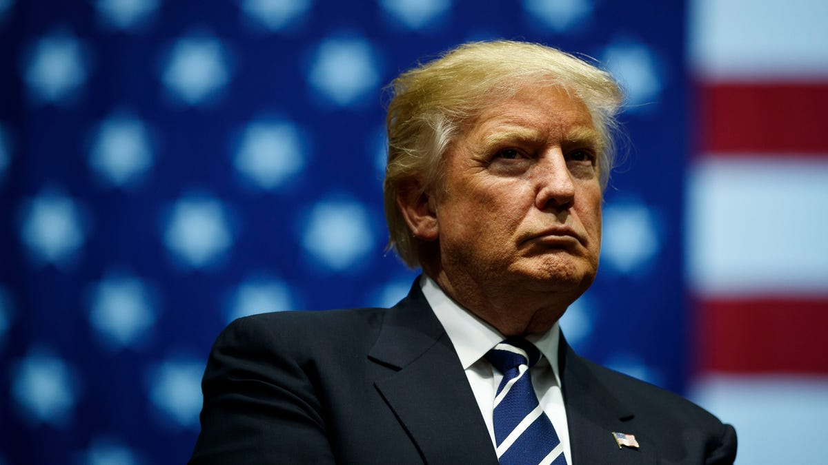 Donald Trump in front of an American Flag background