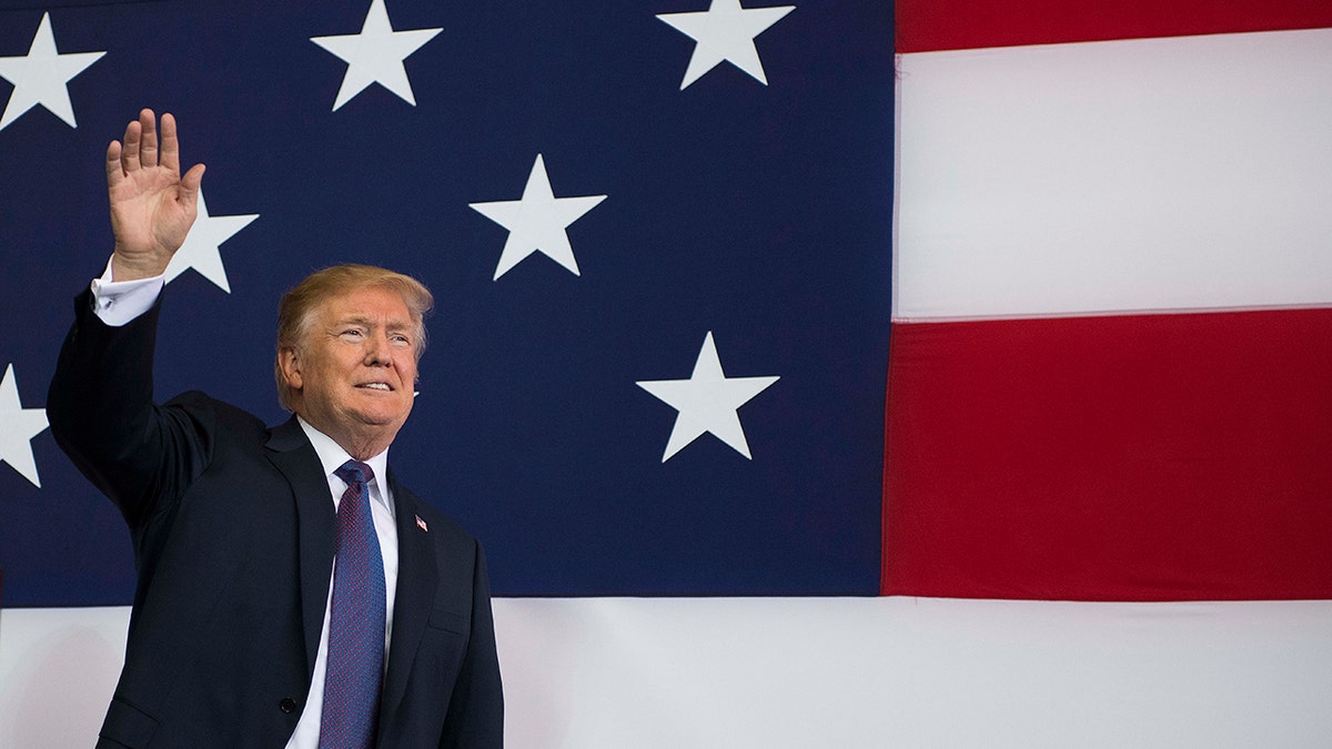 Donald Trump in front of an American flag