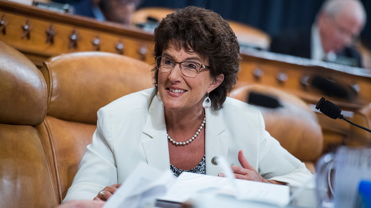 Jackie Walorski sitting in a white suit