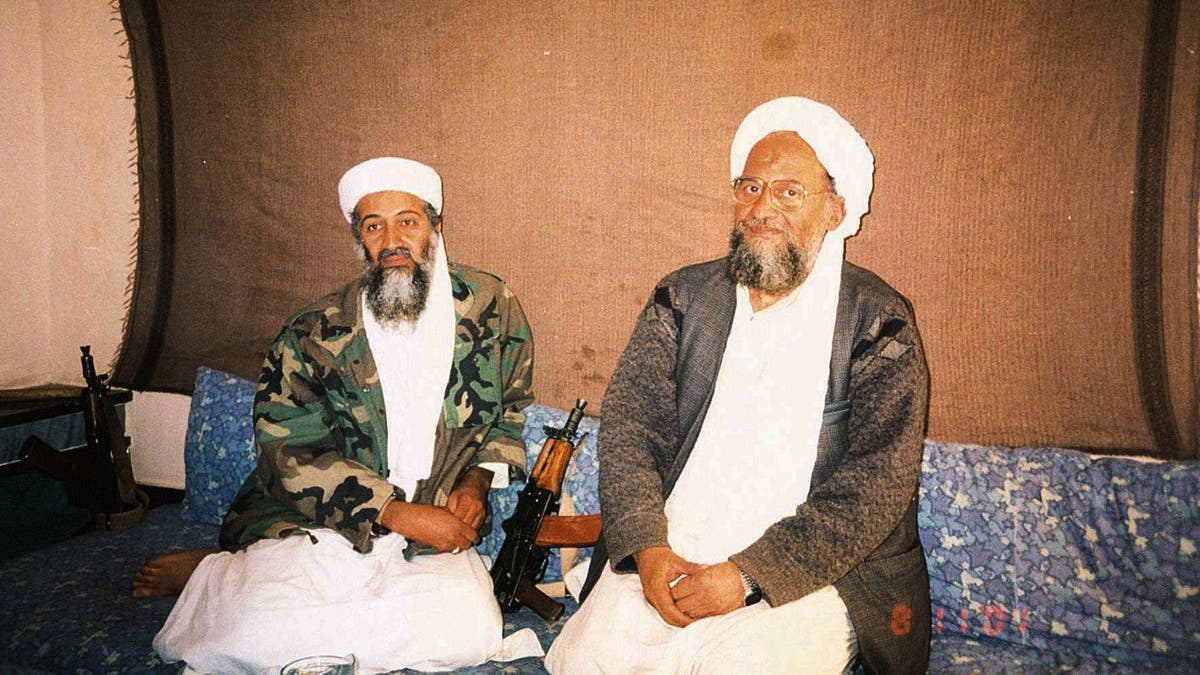 Usama bin Laden and al Qaeda leader Ayman al-Zawahri sitting together