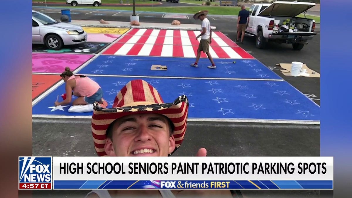 High school seniors paint USA parking spots