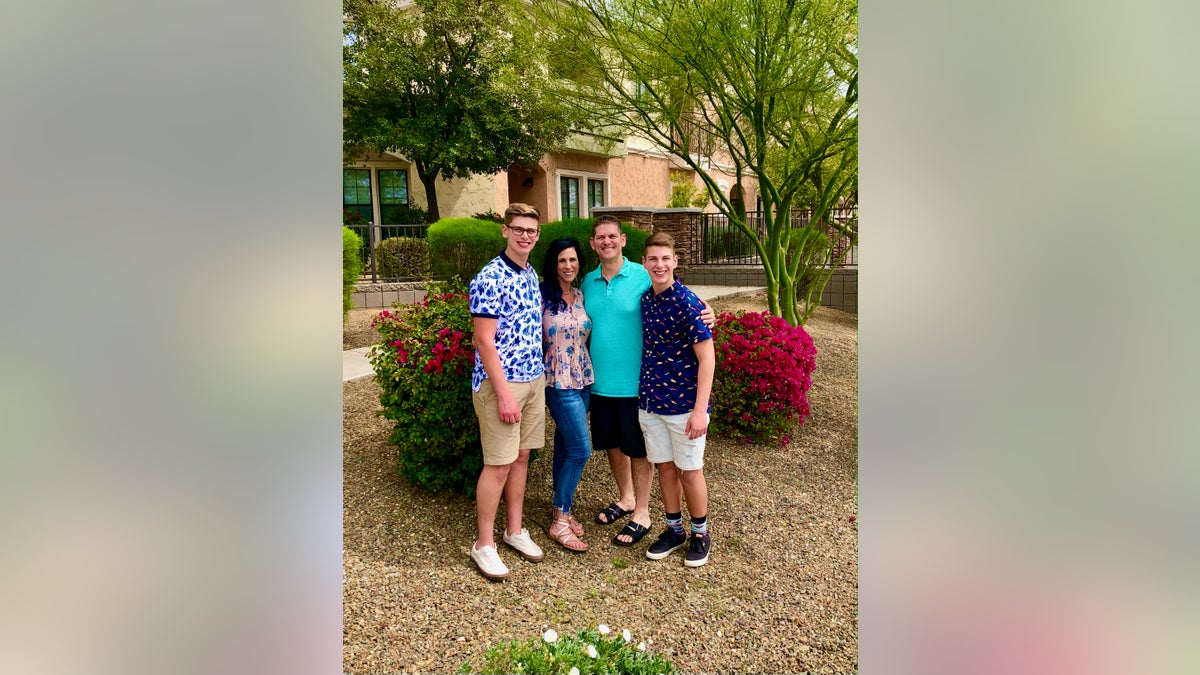 The Raschwal family smiling for a photo