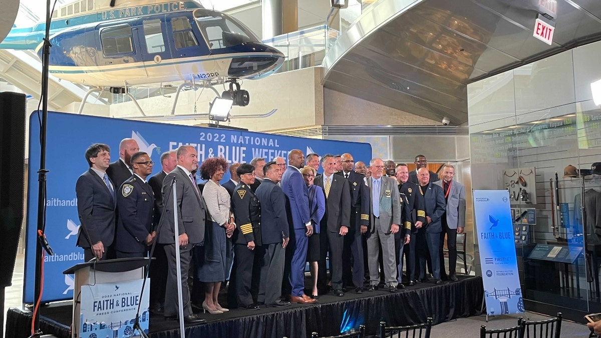 Police leaders gather at the Aug. 9, 2022, Faith & Blue Weekend press conference