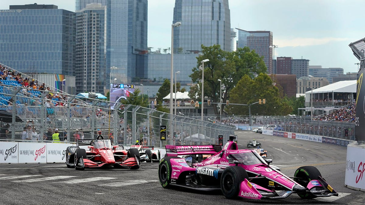 Indy Cars drive on track