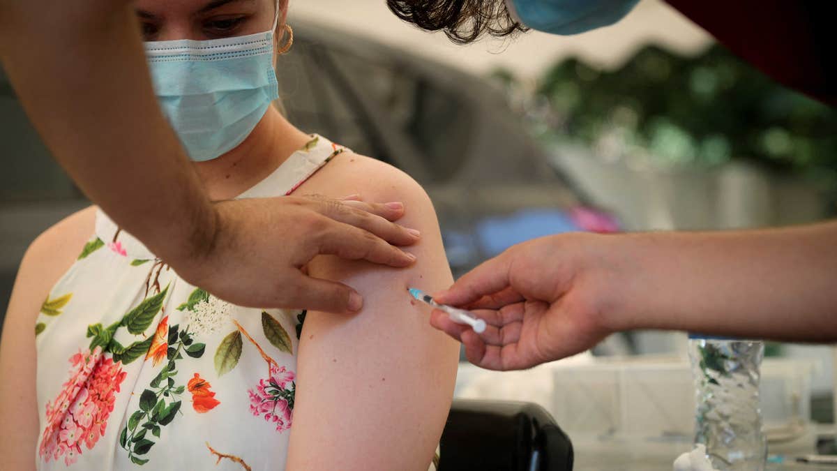 Woman gets covid vaccine