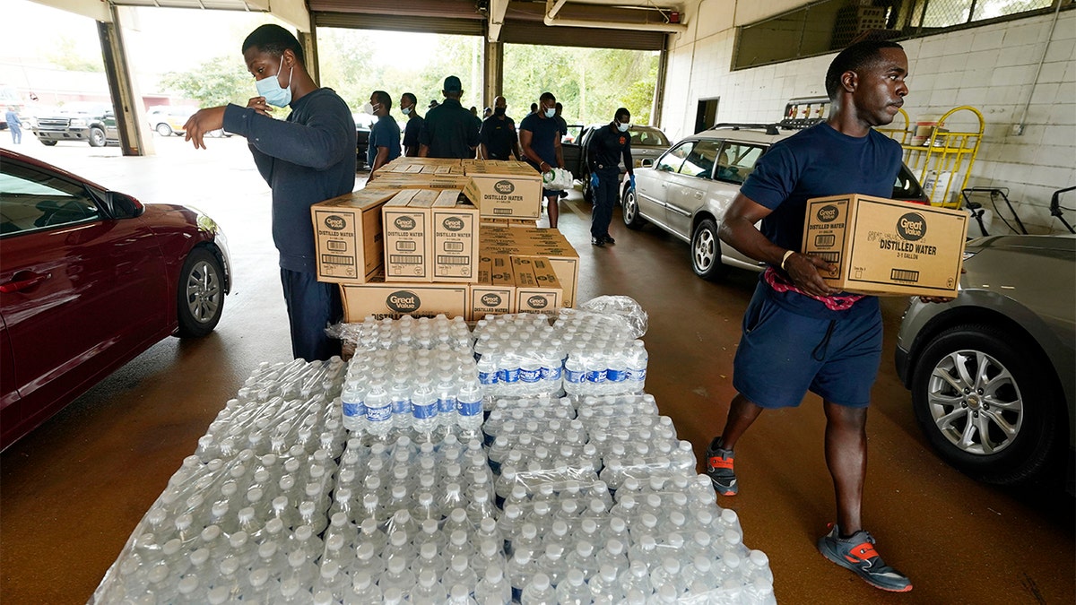 Jackson, Mississippi firefighters hand out bottled water amid water system problems