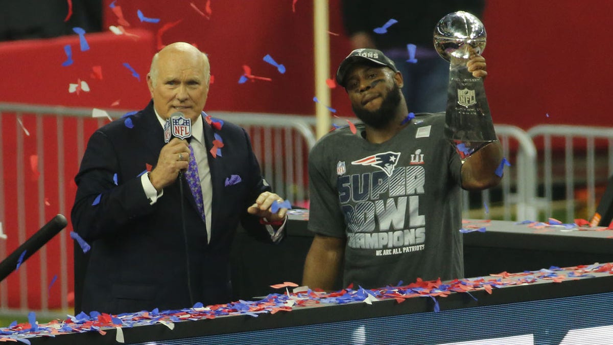 James White holds Vince Lombardi trophy