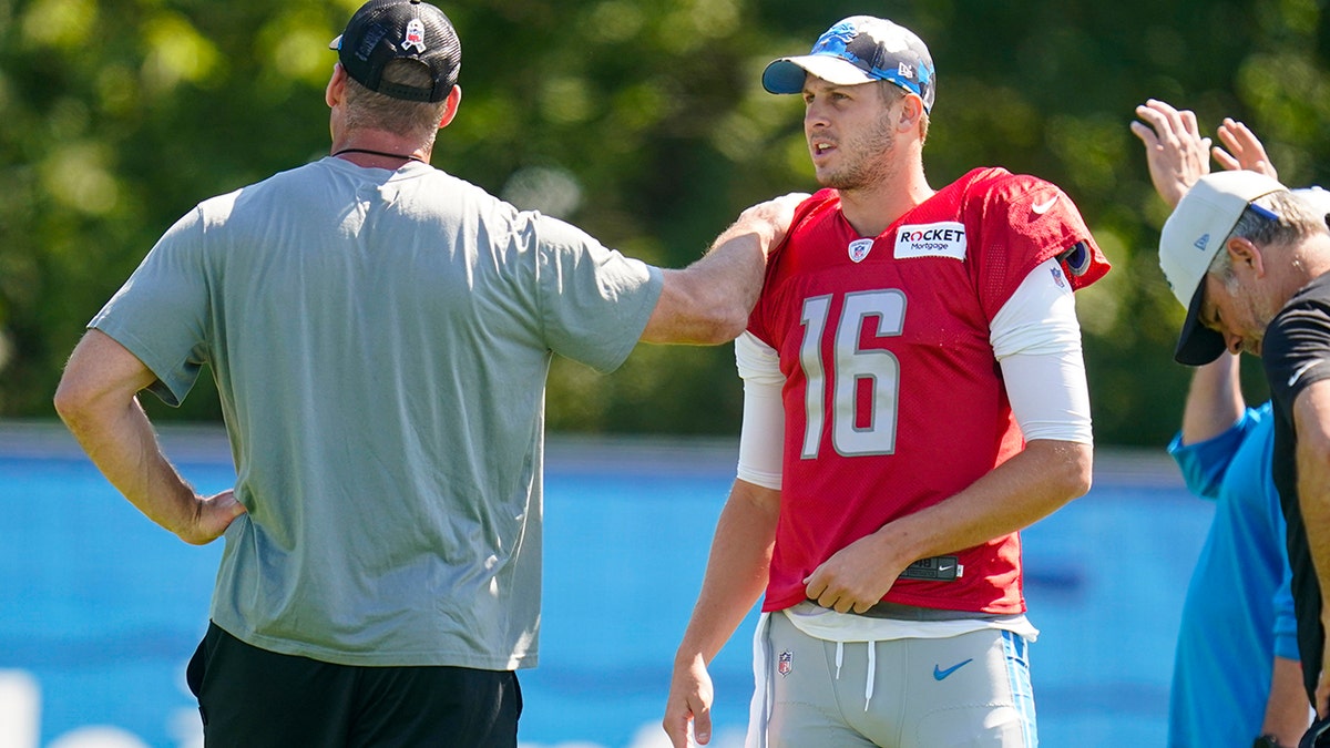 Dan Campbell with Jared Goff