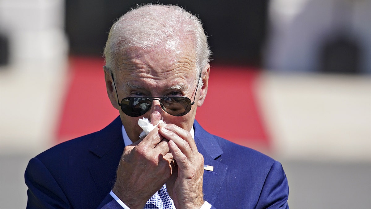 President Biden blowing his nose