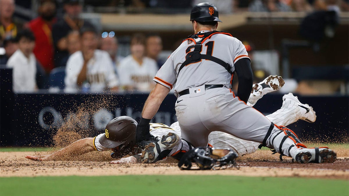 Brandon Drury is tagged out by Joey Bart