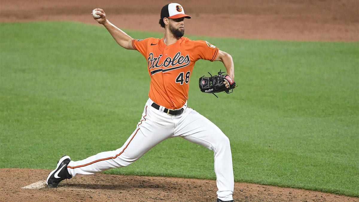 Jorge López throws pitch