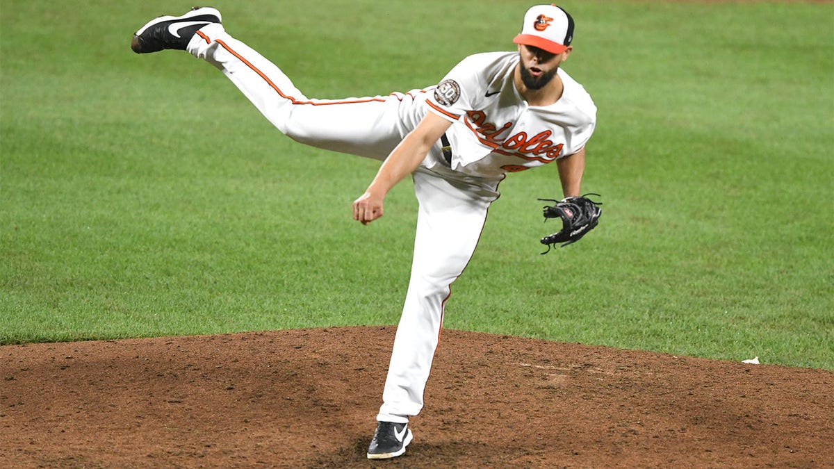 Jorge López throws pitch