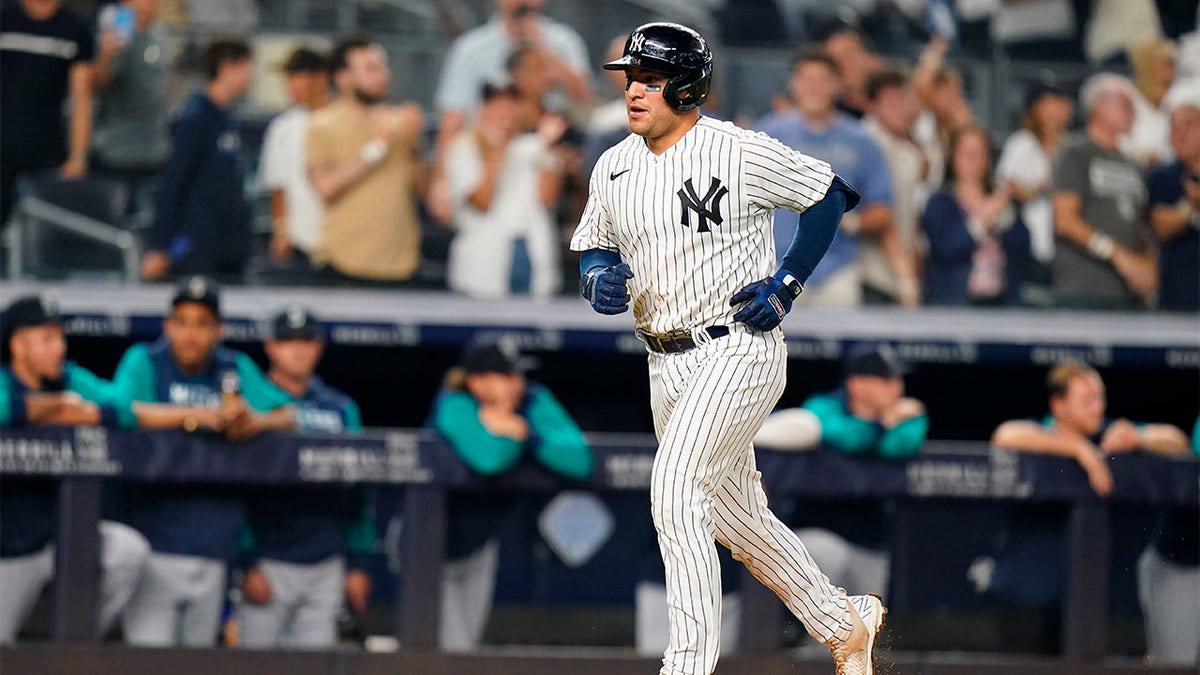 Jose Trevino rounds bases after hitting home run