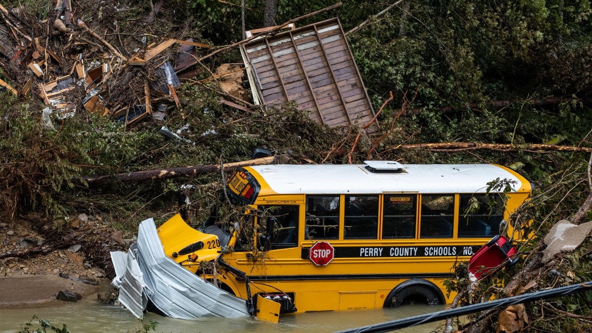 Yellow school bus sits abandoned following flooding in Kentucky.