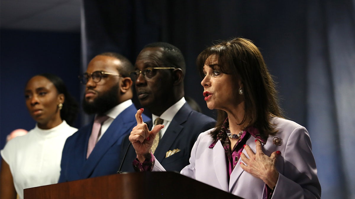 Miami-Dade State Attorney Katherine Fernandez Rundle at a press conference April 3, 2022, announcing a murder charge against influencer Courtney Clenney, 26, for the slaying of her boyfriend Christian Obumseli. Rundle stands next to the family's lawyer Larry Handfield and the victim's brother, Jeff Obumseli.