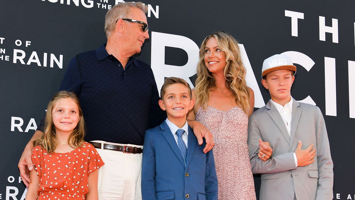 From left to right, Grace Avery Costner, Kevin Costner, Hayes Logan Costner, Christine Baumgartner and Cayden Wyatt Costner attend the premiere of 20th Century Fox's "The Art of Racing in the Rain" on Aug. 1, 2019.