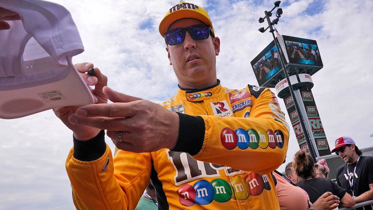 Kyle Busch signs autographs