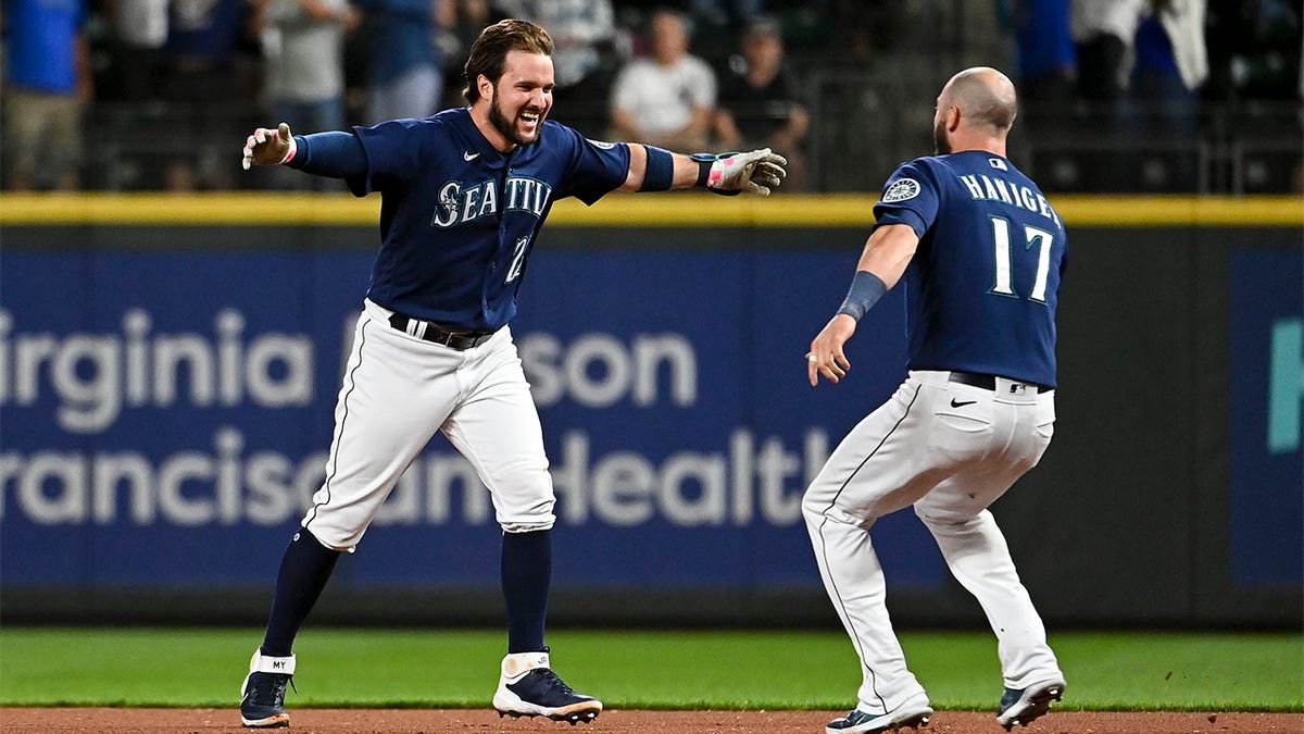 Mitch Haniger goes to hug Luis Torrens