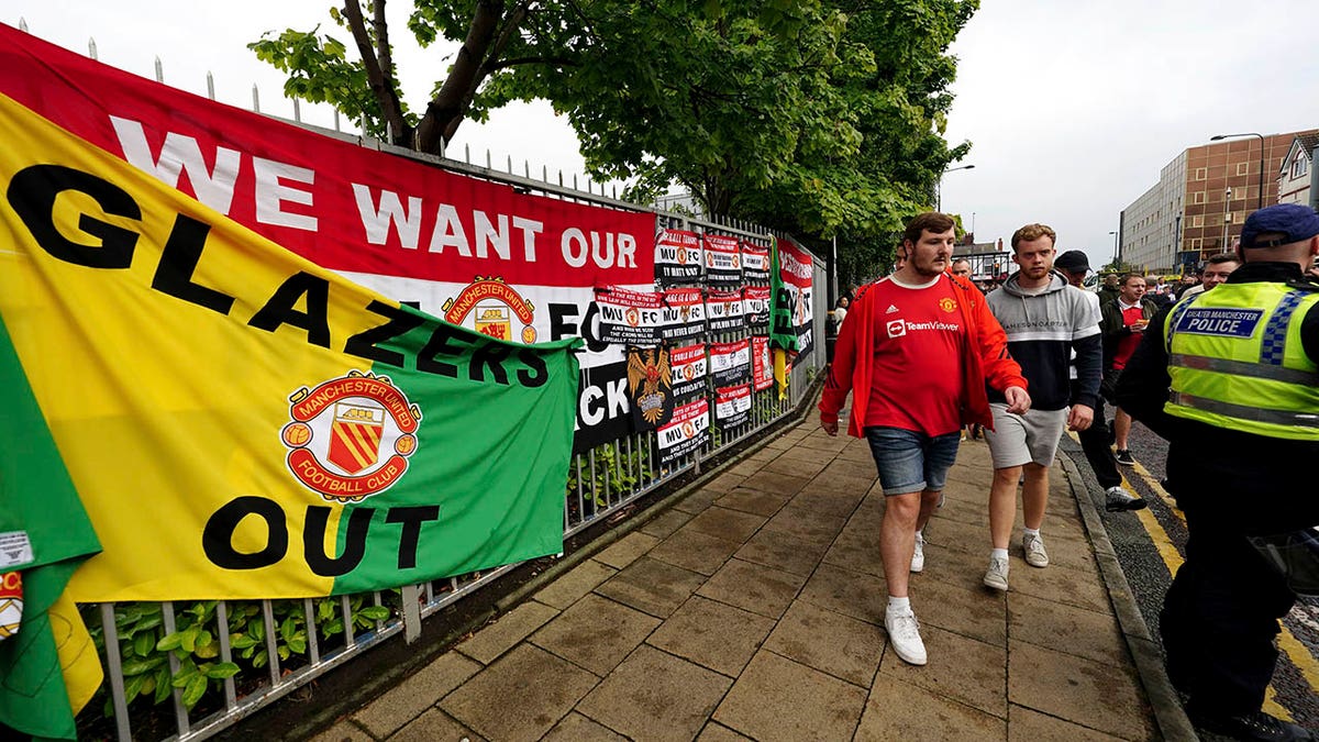 Fans walk Old Trafford