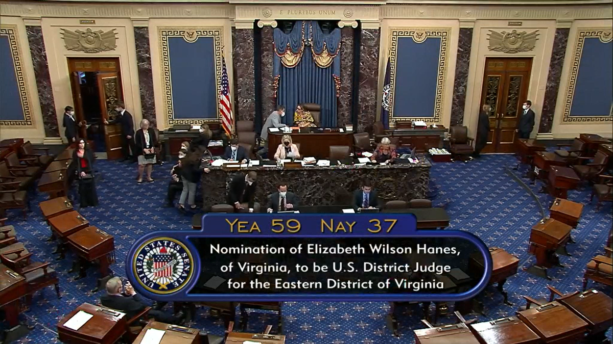 Manchin stands near Sinema