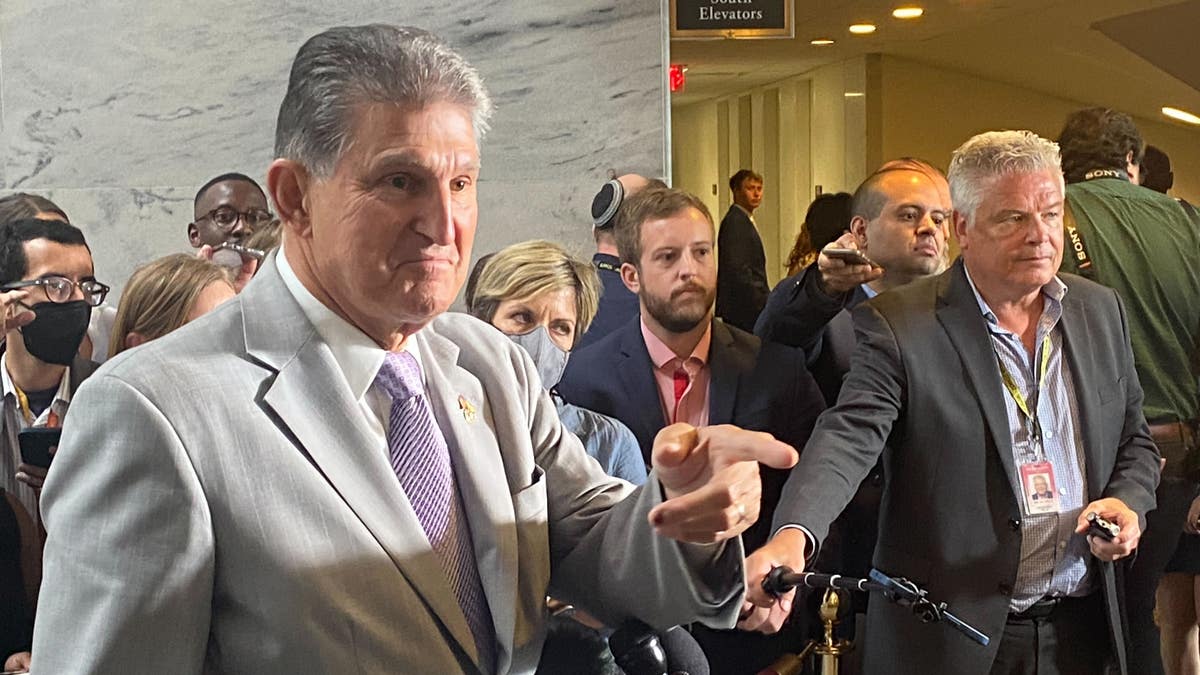 Manchin points at a reporter