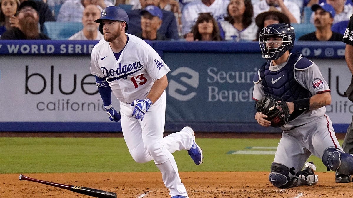 Max Muncy runs to first base