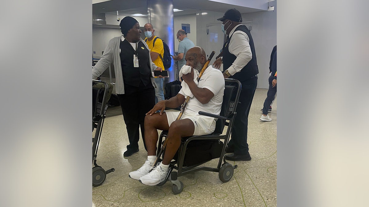 Mike Tyson wheeled in Miami airport