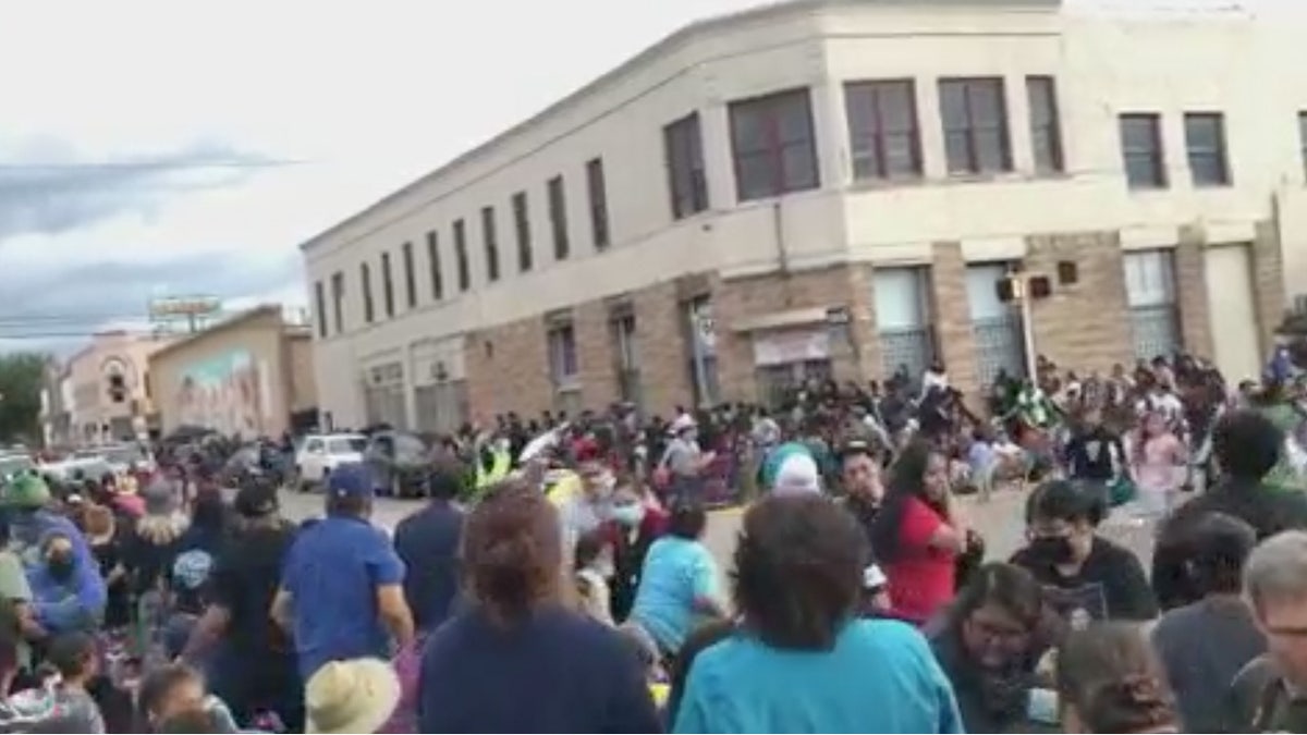 Crowd reacts as SUV speeds through parade