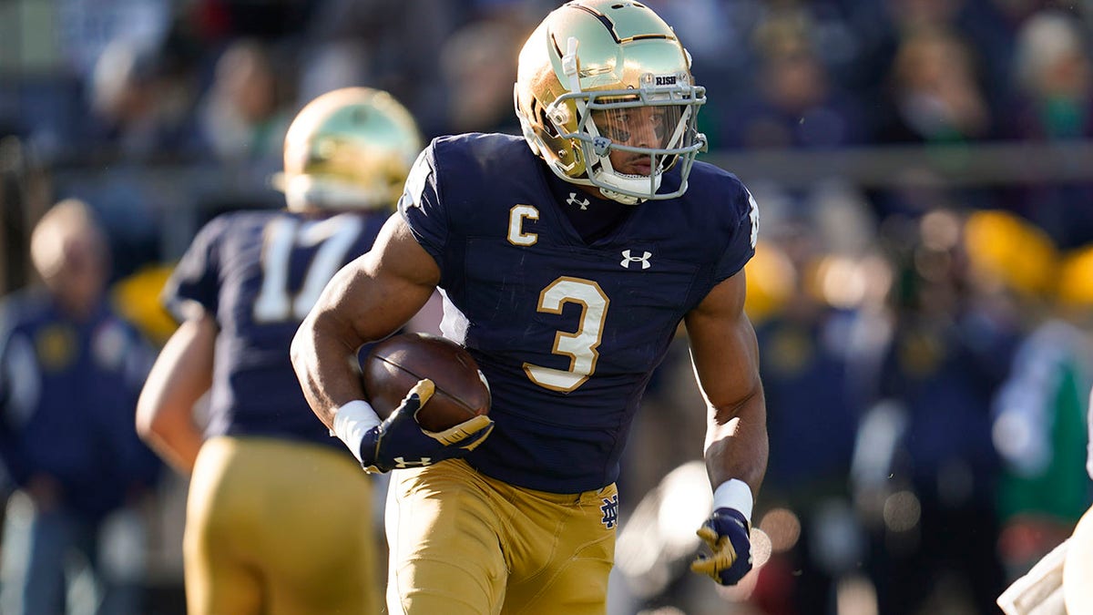 Notre Dame's No. 3 runs with ball