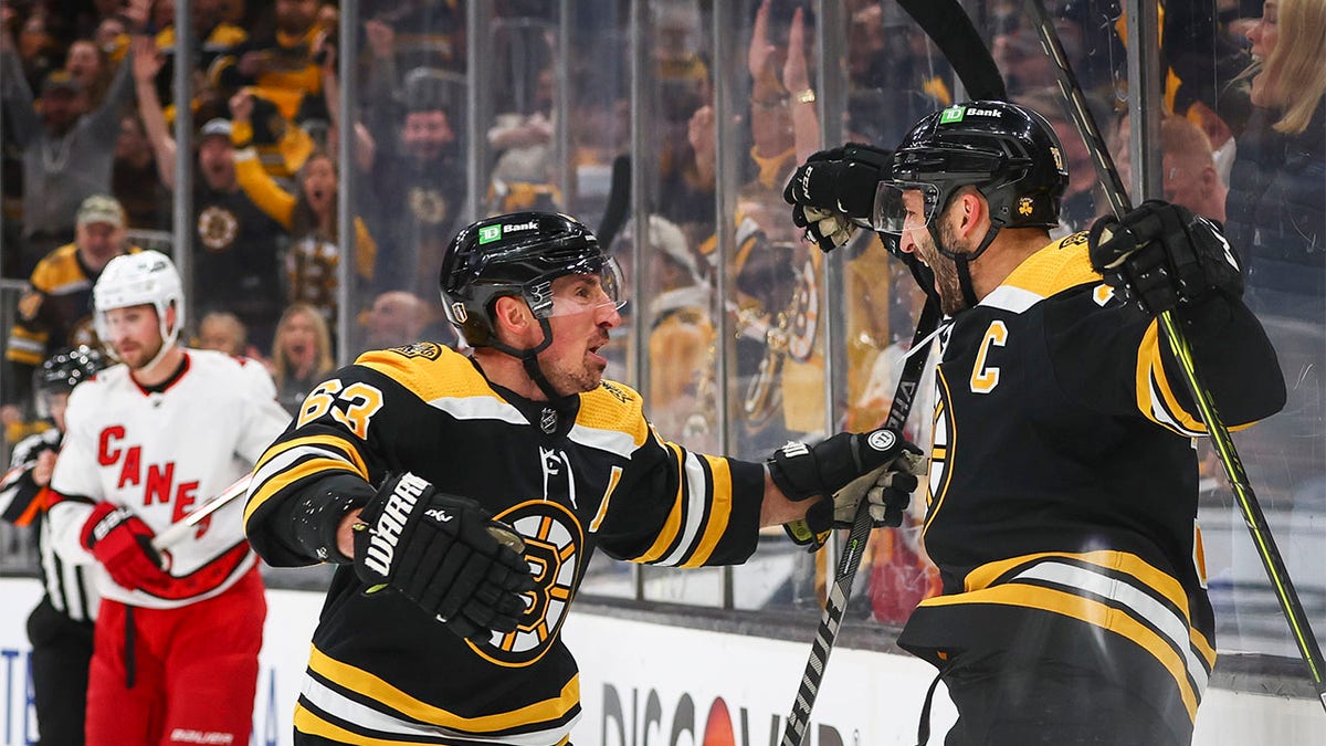 Patrice Bergeron celebrates with Brad Marchand