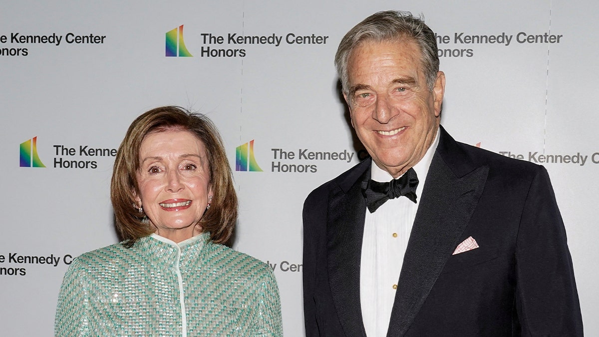 House Speaker Nancy Pelosi and her husband Paul Pelosi smile outside a Kennedy Center celebration