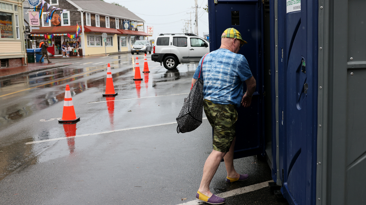Provincetown Massachusetts man entering porta-potty