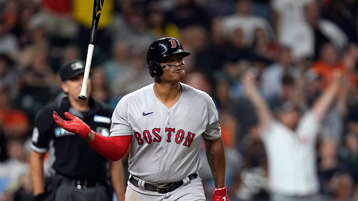 Rafael Devers watches home run