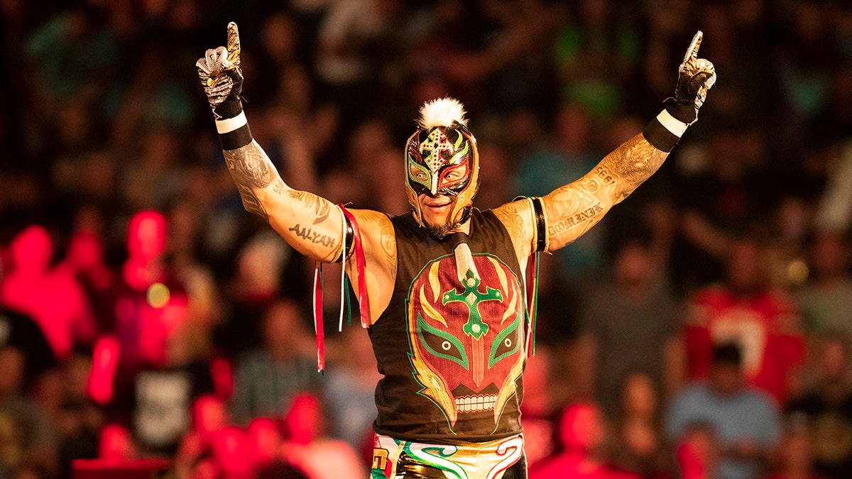 Rey Mysterio waves to the fans
