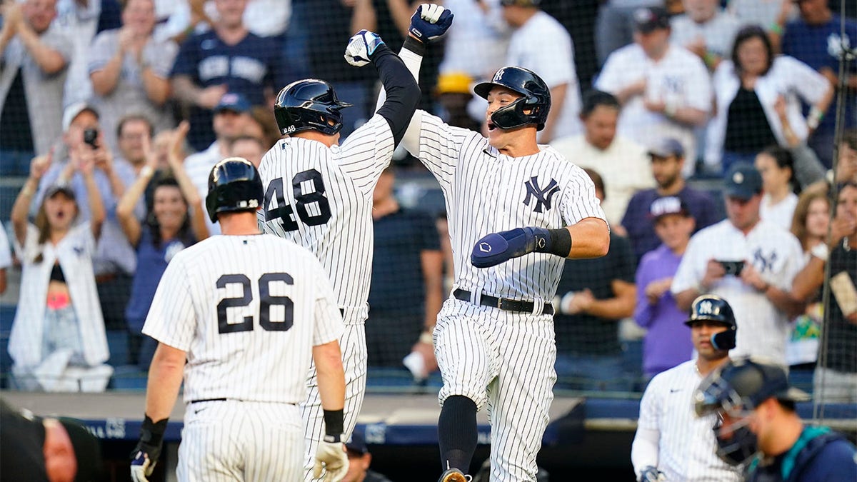 Anthony Risso and Aaron Judge celebrate