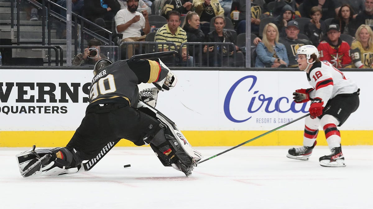 Robin Lehner plays puck