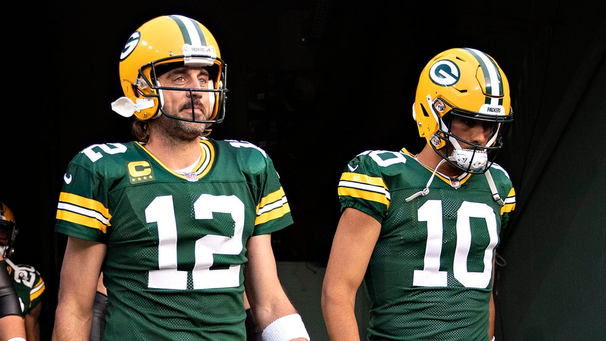 Aaron Rodgers and Jordan Love walking out of tunnel