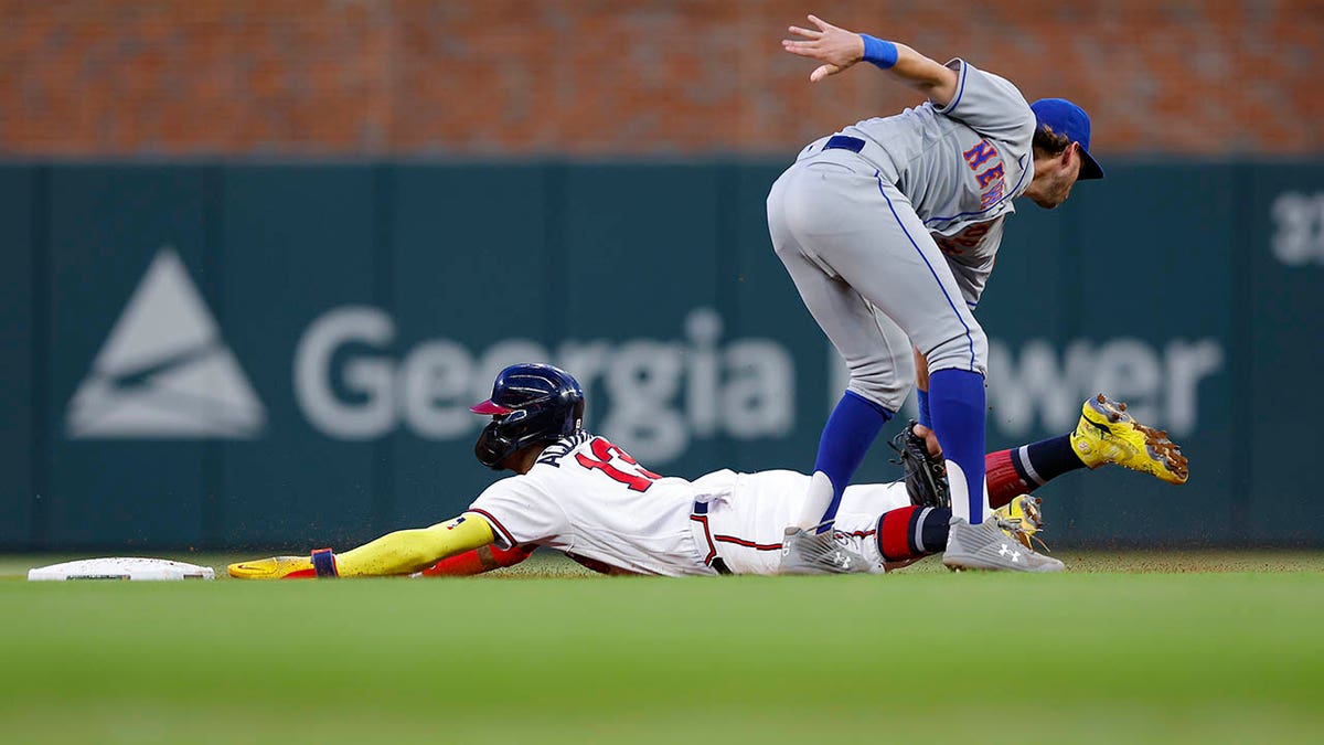 Ronald Acuna Jr dives for second