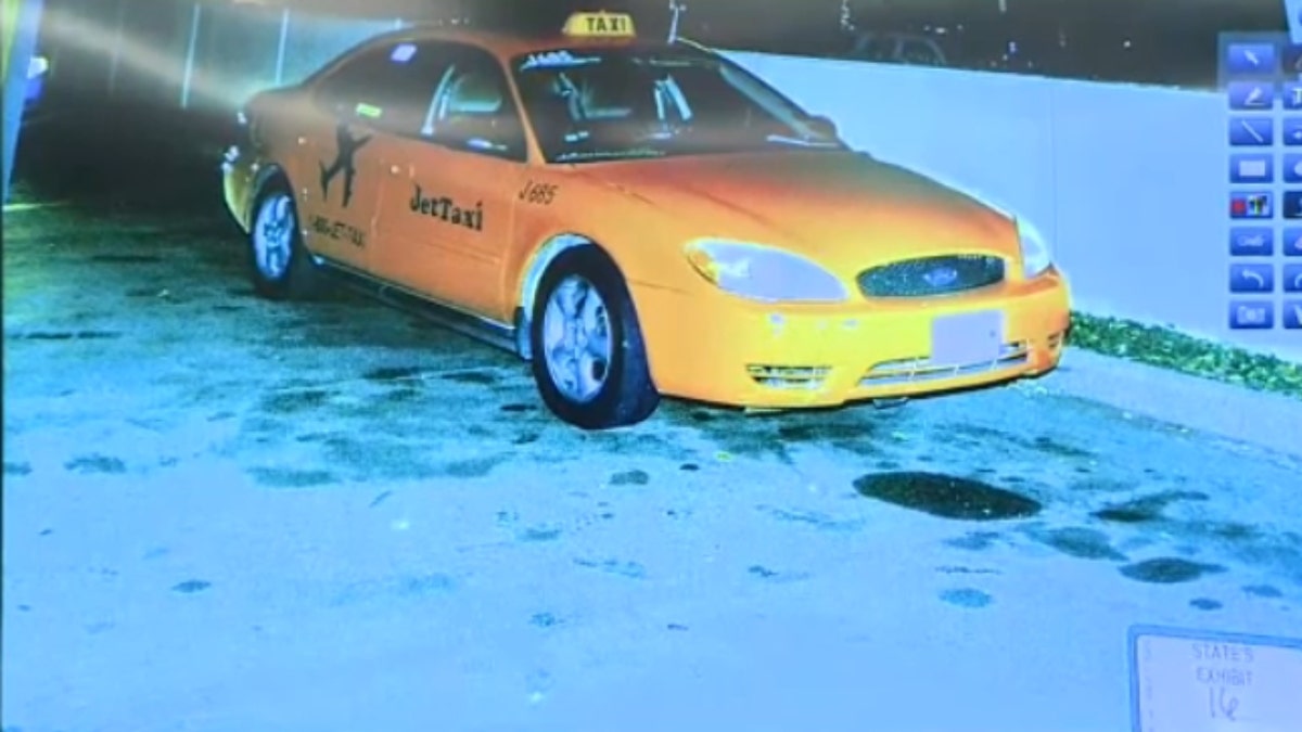 A photo of Yaser Said's yellow taxi is shown in a Dallas courtroom.