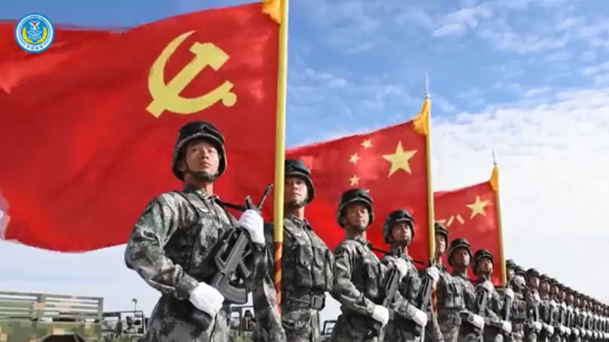 Chinese soldiers with Chinese flag in background