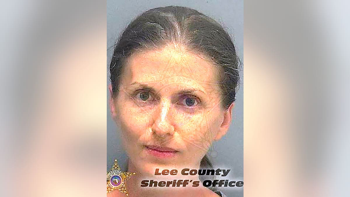 Sheila O’Leary with a ponytail in front of a gray background for her mugshot photo