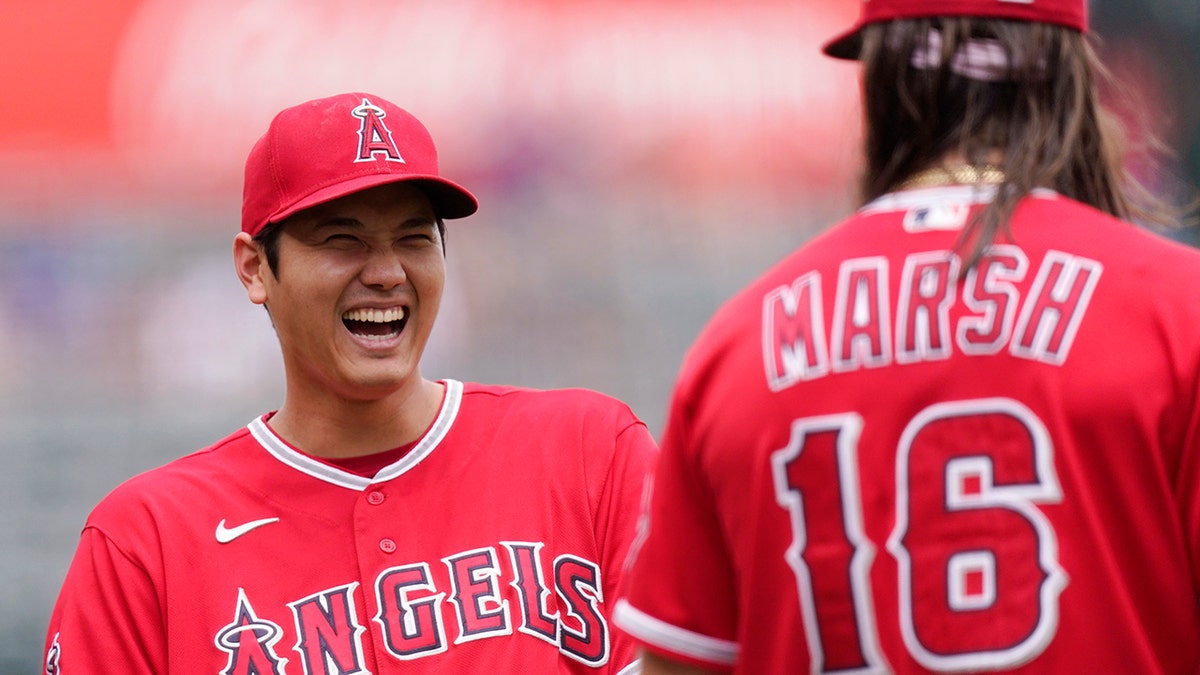 Shohei Ohtani celebrates Brandon Marsh