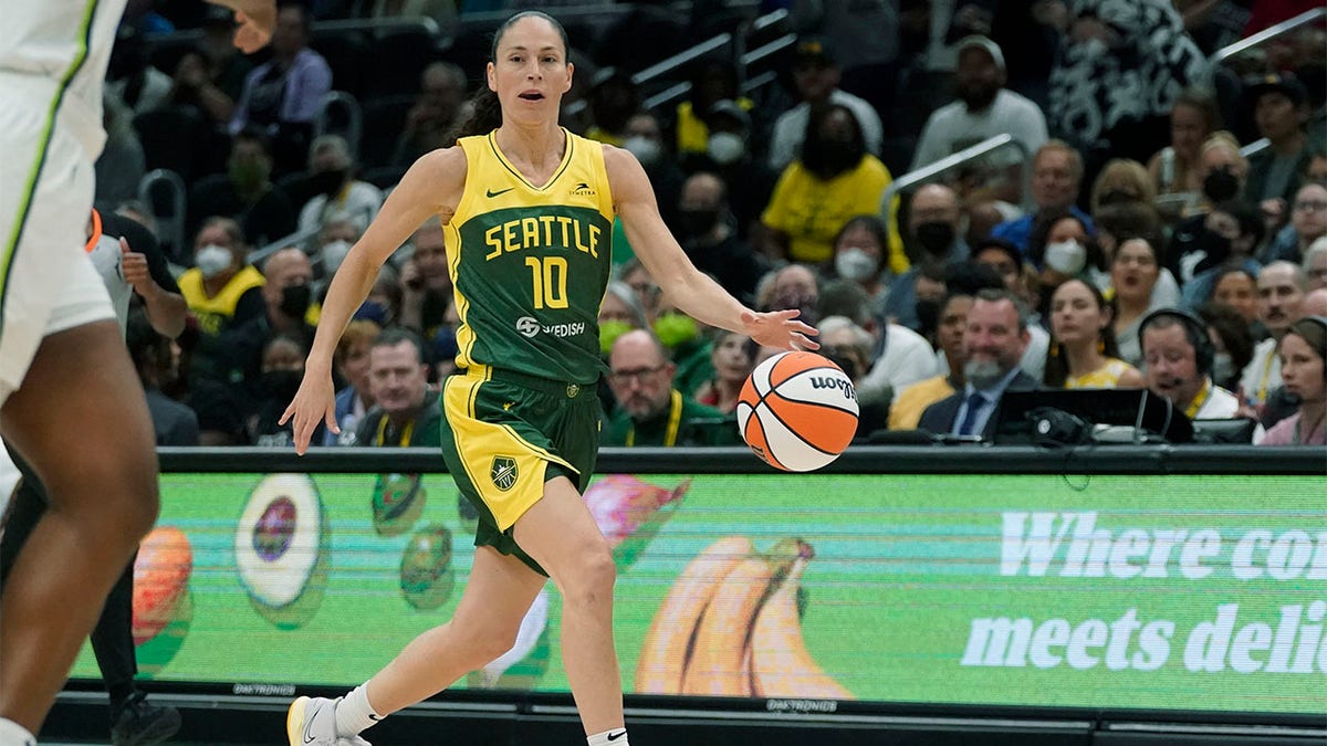 Sue Bird brings ball up court